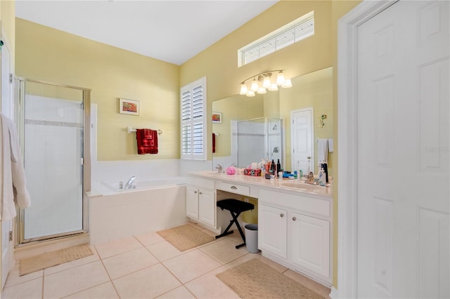 full bath with tile patterned floors, vanity, a garden tub, and a shower stall