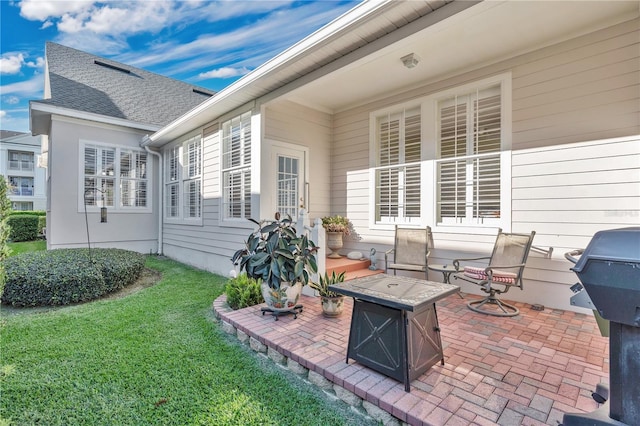 view of patio featuring an outdoor fire pit