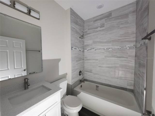 bathroom featuring vanity,  shower combination, and toilet