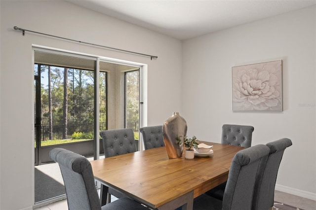 dining space featuring baseboards