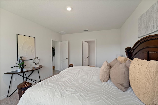 bedroom featuring visible vents and baseboards