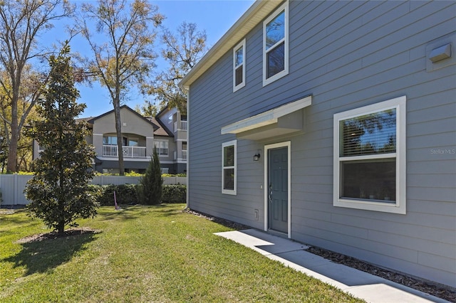 exterior space with a yard and fence