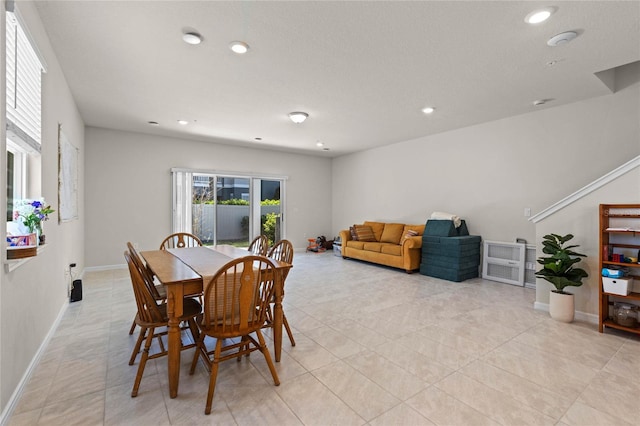 dining space with light tile patterned floors, recessed lighting, and baseboards