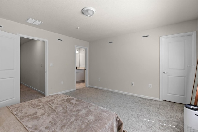 unfurnished bedroom featuring visible vents, carpet floors, and baseboards