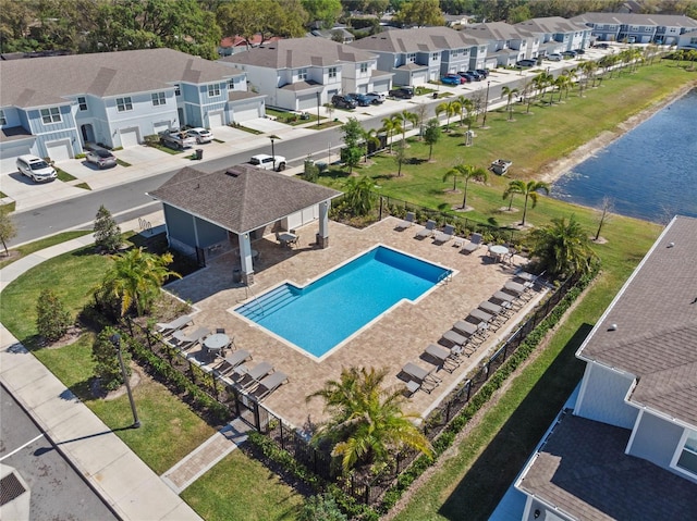 bird's eye view featuring a residential view and a water view