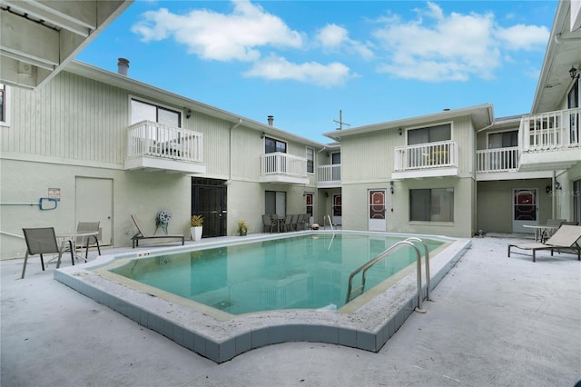 community pool with a patio