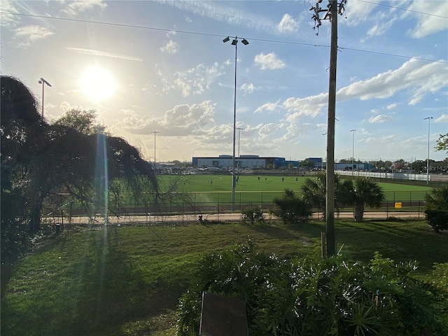 view of yard featuring a rural view and fence