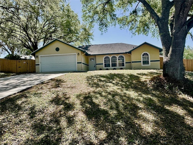 ranch-style house with stucco siding, concrete driveway, a garage, and fence