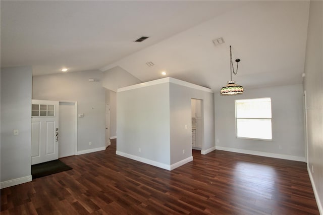 spare room featuring visible vents, recessed lighting, baseboards, lofted ceiling, and dark wood-style flooring