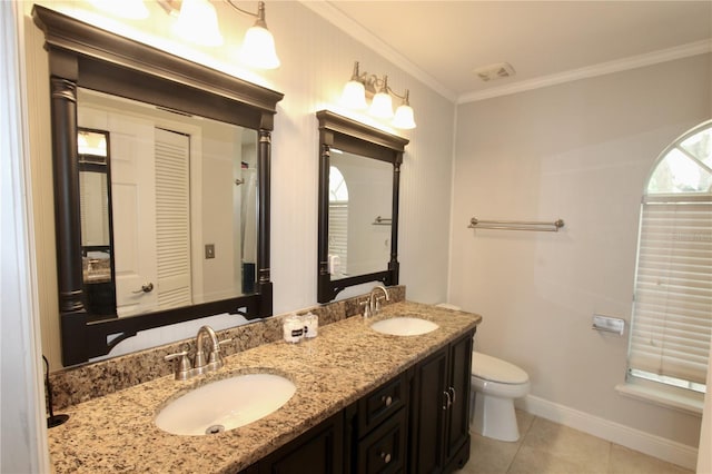 full bathroom with toilet, double vanity, ornamental molding, and a sink