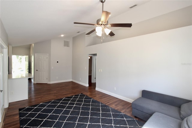 unfurnished living room with visible vents, baseboards, lofted ceiling, and wood finished floors