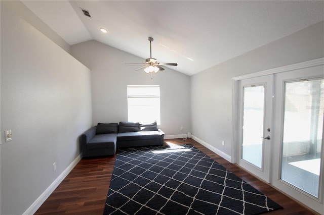 unfurnished living room with wood finished floors, visible vents, baseboards, lofted ceiling, and french doors