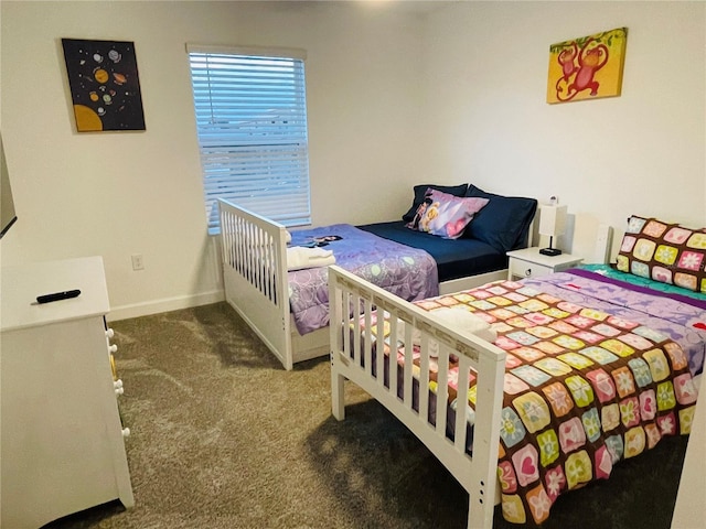 carpeted bedroom with baseboards