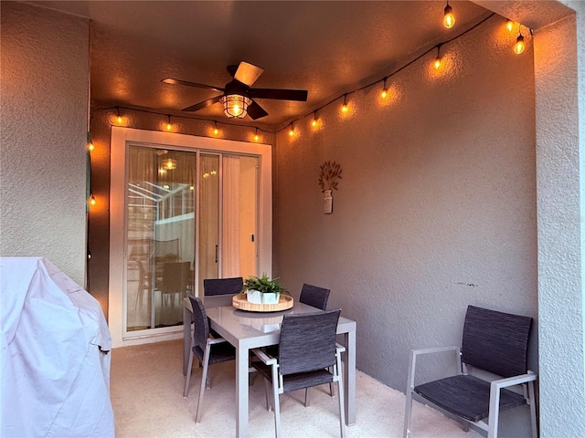 view of patio featuring outdoor dining area and a ceiling fan