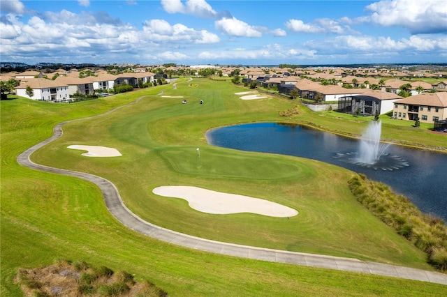 aerial view featuring a residential view, view of golf course, and a water view