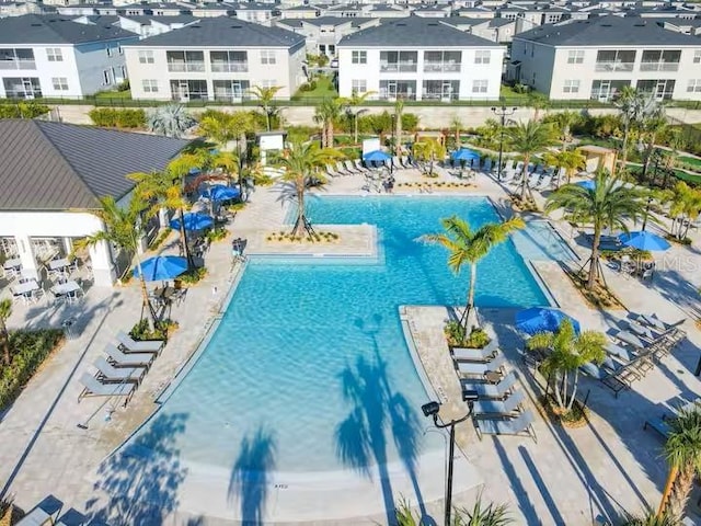 view of swimming pool with a residential view