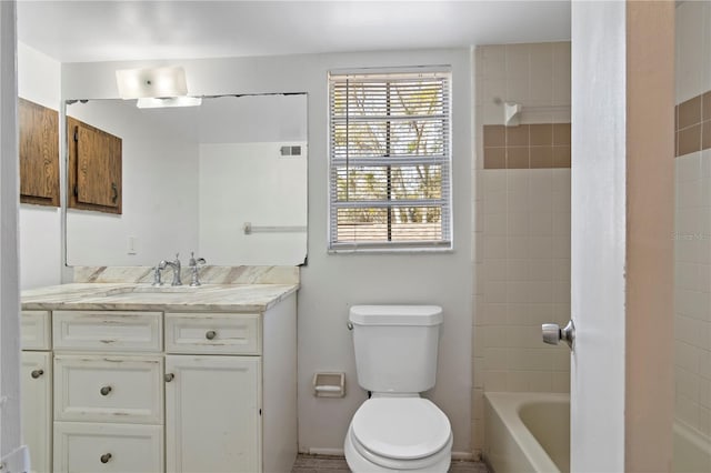 full bathroom featuring vanity, toilet, and visible vents