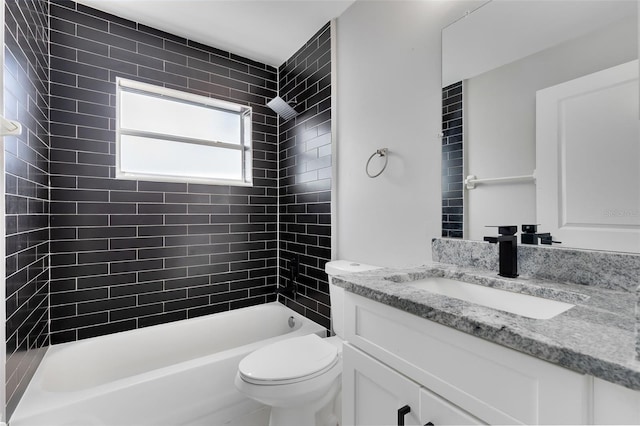 bathroom featuring vanity, toilet, and bathtub / shower combination