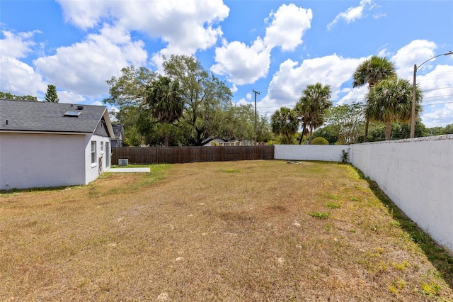 view of yard featuring a fenced backyard