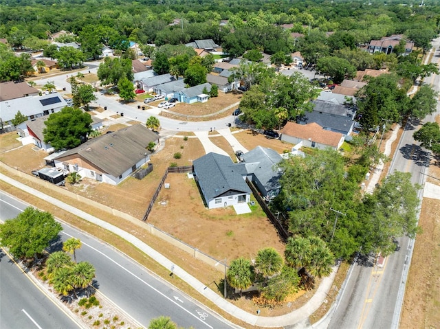 birds eye view of property with a residential view and a wooded view