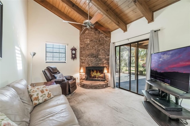 carpeted living area featuring beamed ceiling, wood ceiling, a fireplace, high vaulted ceiling, and a ceiling fan