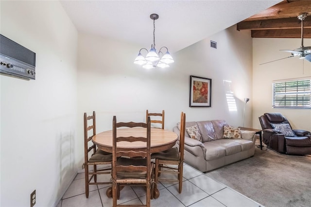 dining room with light carpet, visible vents, ceiling fan with notable chandelier, and vaulted ceiling with beams