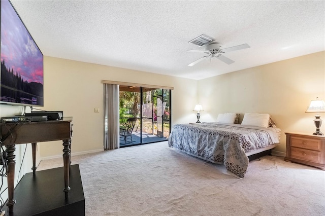 bedroom with a ceiling fan, visible vents, carpet floors, access to exterior, and a textured ceiling