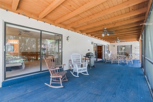 view of patio featuring outdoor dining area, a ceiling fan, and grilling area