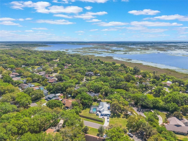 drone / aerial view with a residential view and a water view