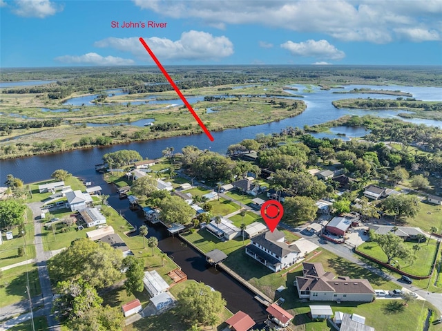 birds eye view of property with a residential view and a water view