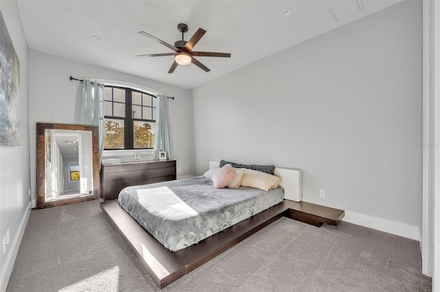 bedroom with baseboards, a ceiling fan, and carpet flooring