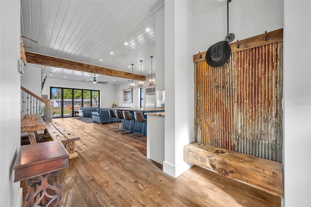 interior space with stairway, beam ceiling, recessed lighting, a ceiling fan, and wood-type flooring