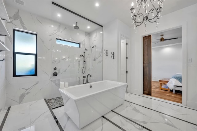 bathroom featuring stone wall, a marble finish shower, marble finish floor, and recessed lighting