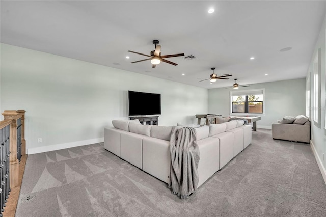 carpeted living area with a ceiling fan, visible vents, recessed lighting, and baseboards