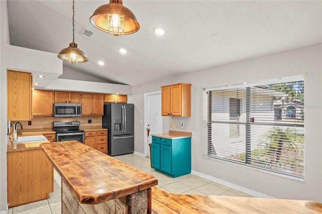 kitchen with visible vents, light countertops, light tile patterned floors, appliances with stainless steel finishes, and a sink