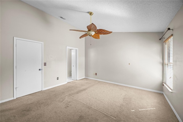 unfurnished bedroom with carpet flooring, multiple windows, and a textured ceiling