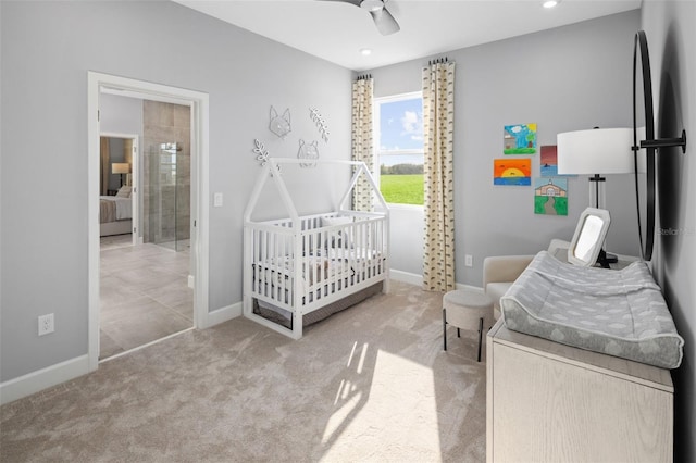 bedroom with carpet, baseboards, a ceiling fan, recessed lighting, and a crib