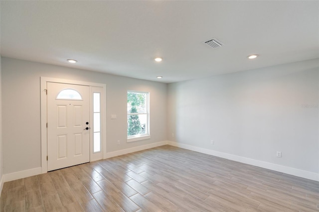 entryway featuring recessed lighting, visible vents, baseboards, and light wood-style flooring