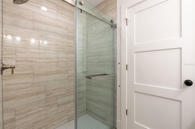 full bath with a shower stall