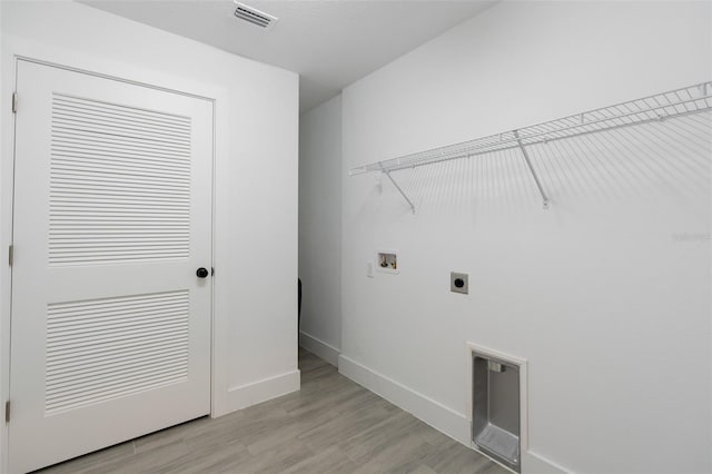 washroom featuring visible vents, light wood finished floors, laundry area, electric dryer hookup, and washer hookup