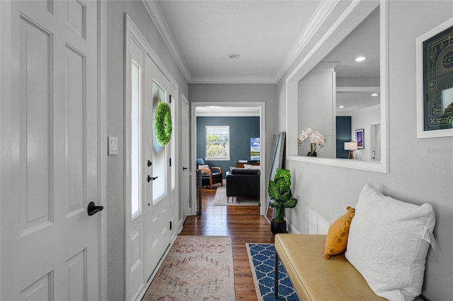 entrance foyer with recessed lighting, wood finished floors, and ornamental molding