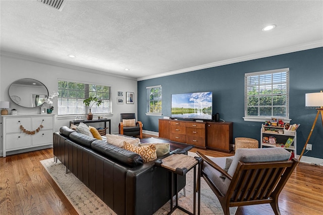 living room with plenty of natural light and wood finished floors