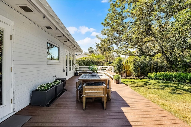 wooden deck featuring an outdoor hangout area and a lawn