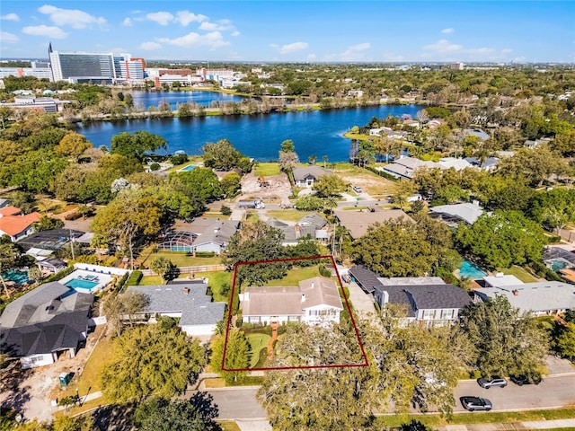 bird's eye view with a residential view and a water view