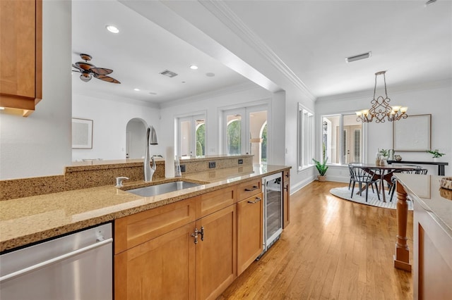 kitchen featuring a sink, visible vents, wine cooler, and dishwasher