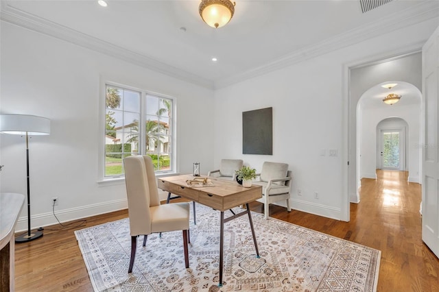 home office featuring wood finished floors, baseboards, recessed lighting, arched walkways, and ornamental molding