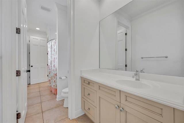 bathroom with visible vents, a shower with curtain, toilet, tile patterned flooring, and vanity