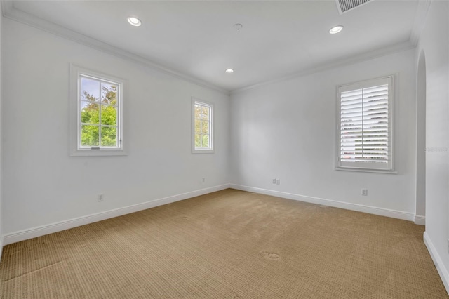 unfurnished room with recessed lighting, baseboards, light colored carpet, and crown molding