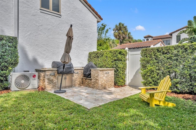 view of yard featuring a patio area, area for grilling, and ac unit