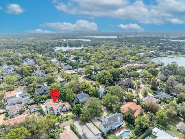 birds eye view of property featuring a residential view and a water view